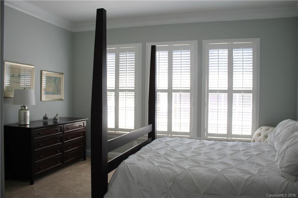 724 Revival Row Fort Mill, SC 29708 - Photo 9 of 15 a bed sitting in a bedroom next to a window