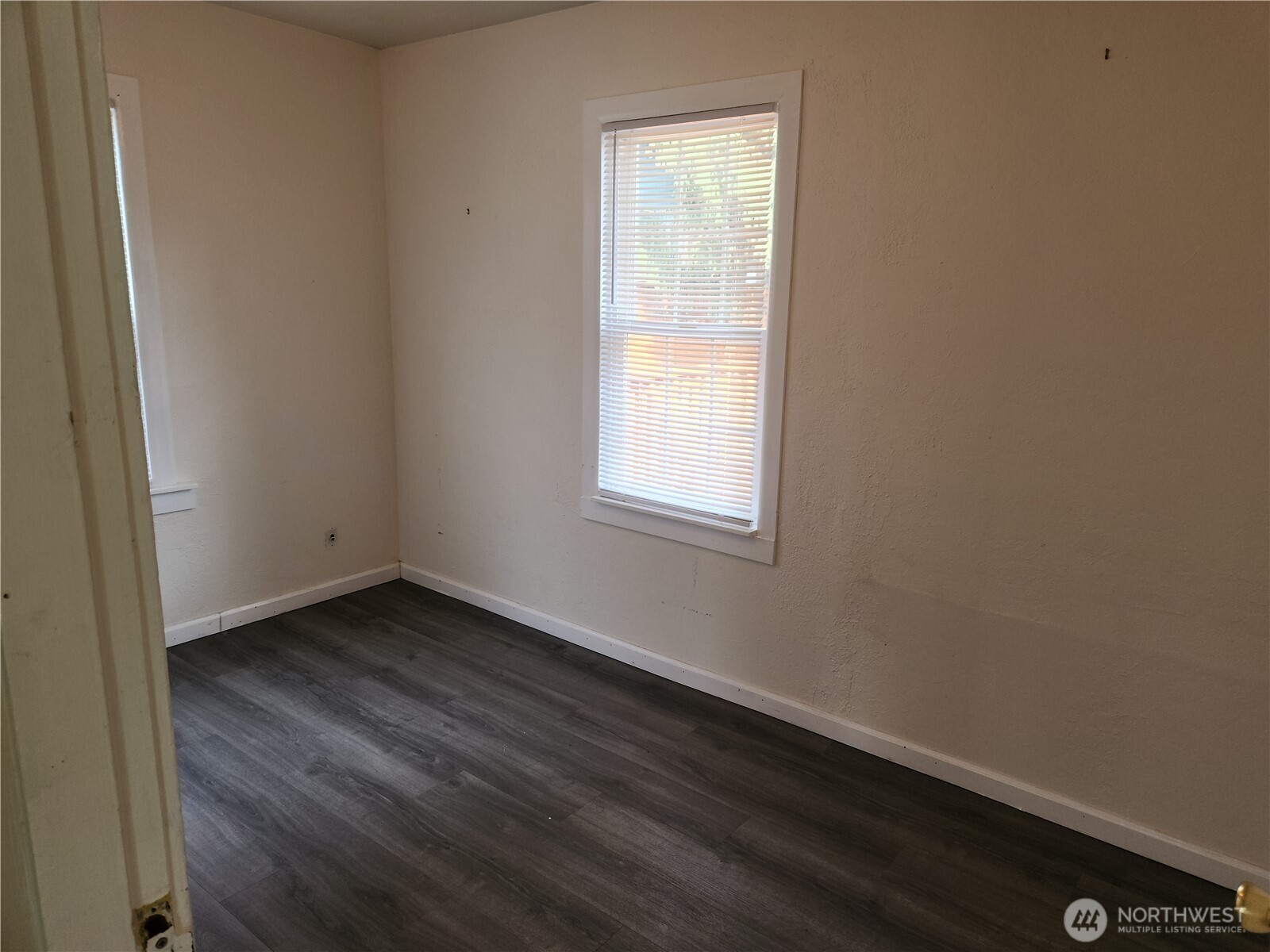2902 Dover Street Longview, WA 98632 - Photo 22 of 23 a view of an empty room with wooden floor and a window