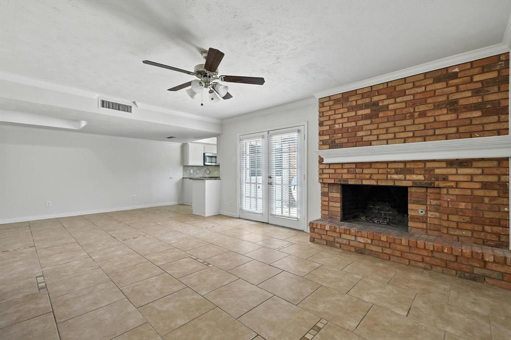 5024 Middleton Circle The Colony, TX 75056 - Photo 11 of 30 a view of a livingroom with a fireplace and window