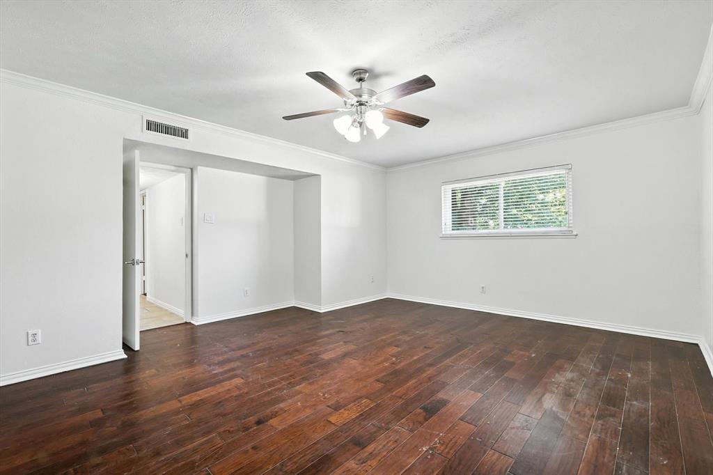 5024 Middleton Circle The Colony, TX 75056 - Photo 19 of 30 a view of an empty room with wooden floor and a window
