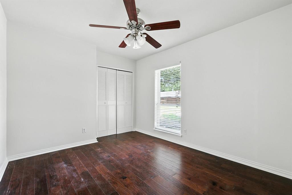 5024 Middleton Circle The Colony, TX 75056 - Photo 22 of 30 an empty room with wooden floor fan and windows