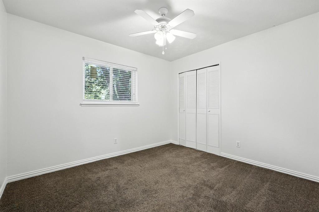 5024 Middleton Circle The Colony, TX 75056 - Photo 25 of 30 an empty room with a window and a fan
