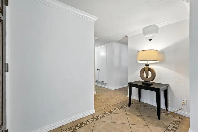 a view of a hallway with paintings on the wall
