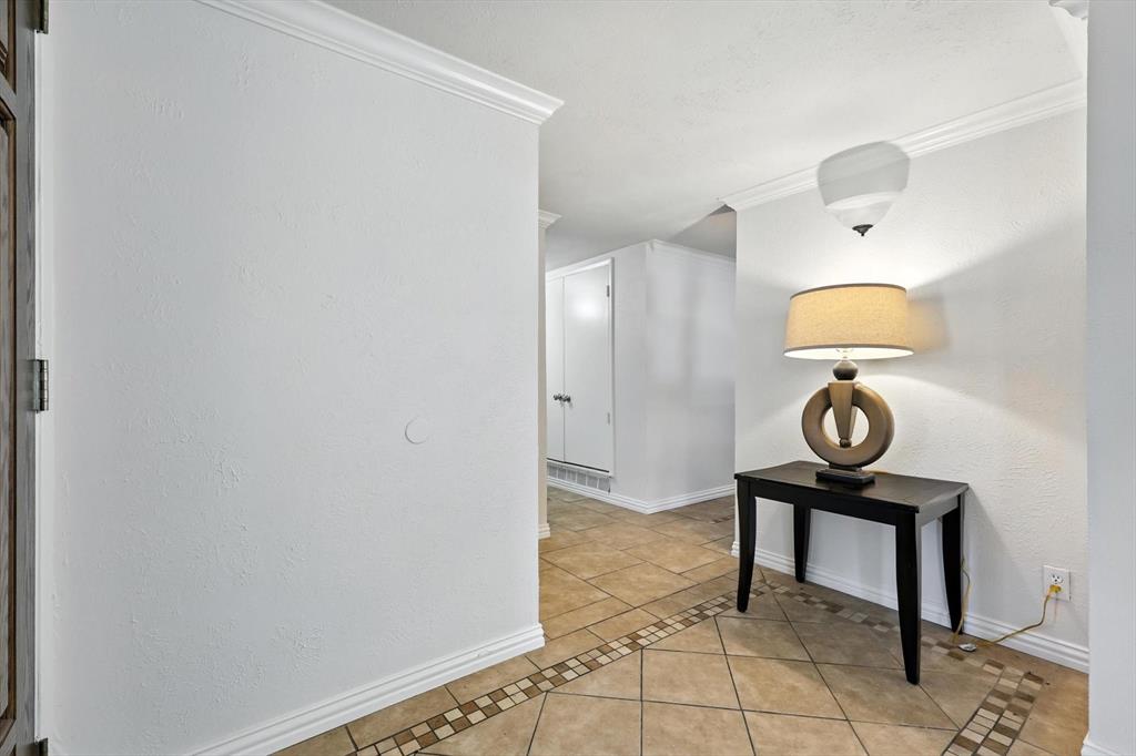 5024 Middleton Circle The Colony, TX 75056 - Photo 5 of 30 a view of a hallway with paintings on the wall
