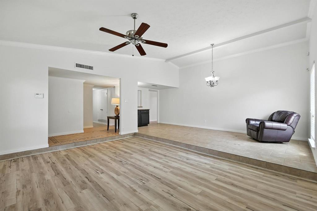 5024 Middleton Circle The Colony, TX 75056 - Photo 7 of 30 a view of a livingroom with a ceiling fan and wooden floor