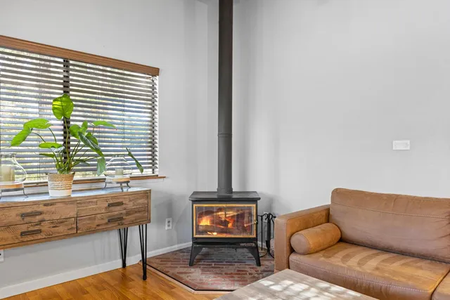 a bedroom with a bed and with the couch