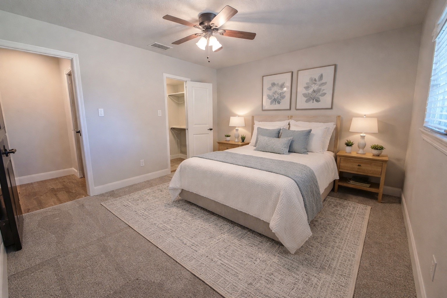 19103 Whitewood Drive Spring, TX 77373 - Photo 15 of 30 a bedroom with a bed and a chandelier
