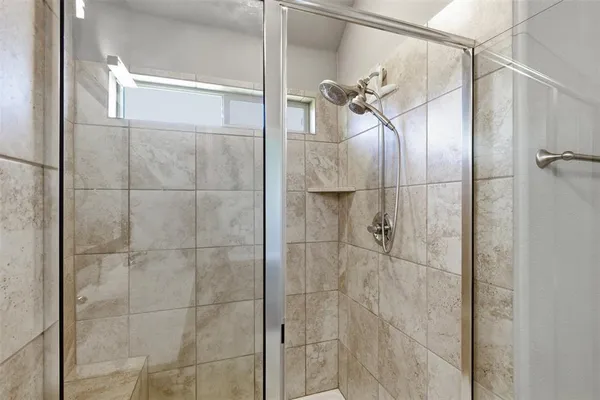 a spacious bathroom with a double vanity sink a mirror and a bathtub