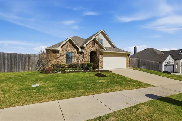 a front view of a house with yard
