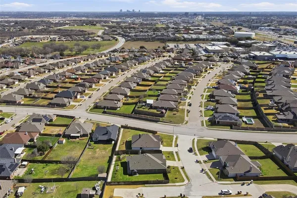 an aerial view of residential houses with outdoor space