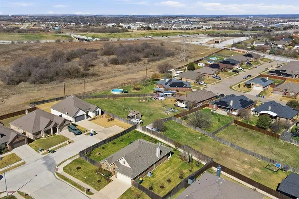 an aerial view of a house with a ocean view