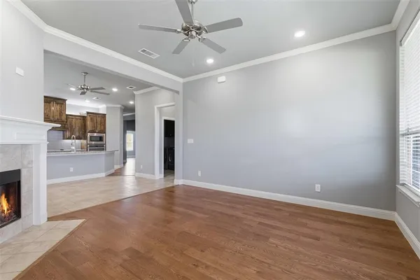 wooden floor in an empty room with a fireplace
