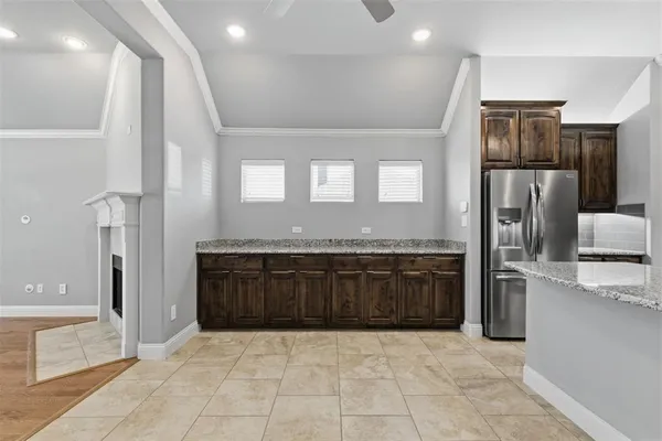a large bathroom with a granite countertop double vanity sink and a bathtub