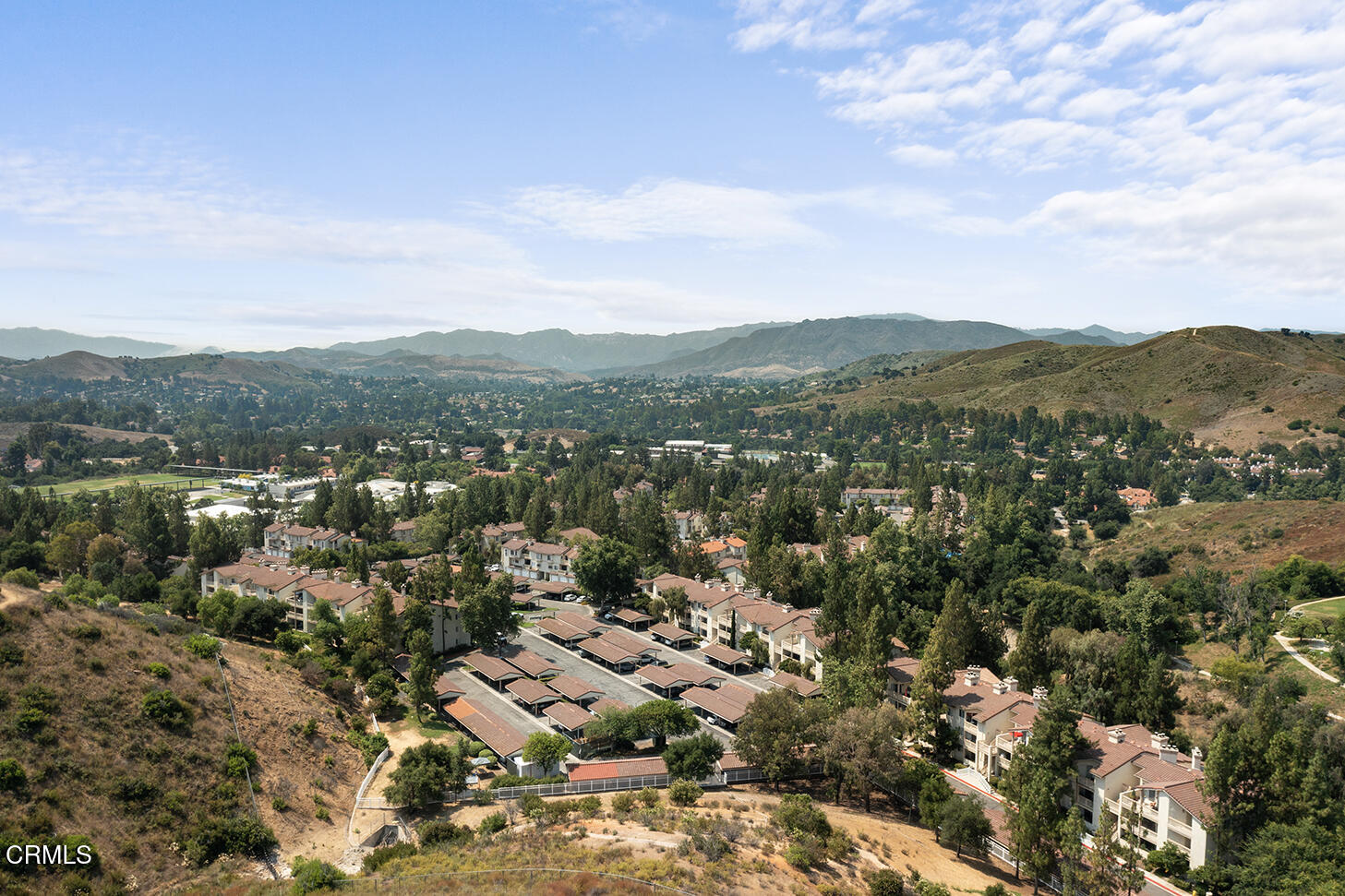 697 Sutton Crest Trail, Unit 304 Oak Park, CA 91377 - Photo 15 of 21 an aerial view of residential house with outdoor space