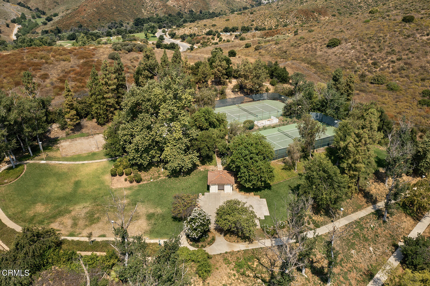 697 Sutton Crest Trail, Unit 304 Oak Park, CA 91377 - Photo 16 of 21 an aerial view of residential houses with outdoor space