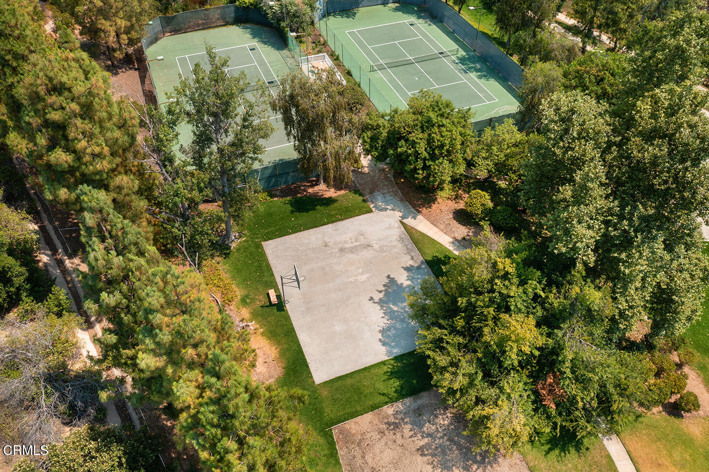 697 Sutton Crest Trail, Unit 304 Oak Park, CA 91377 - Photo 19 of 21 an aerial view of a house with a yard