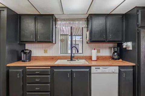 a kitchen with a sink and cabinets