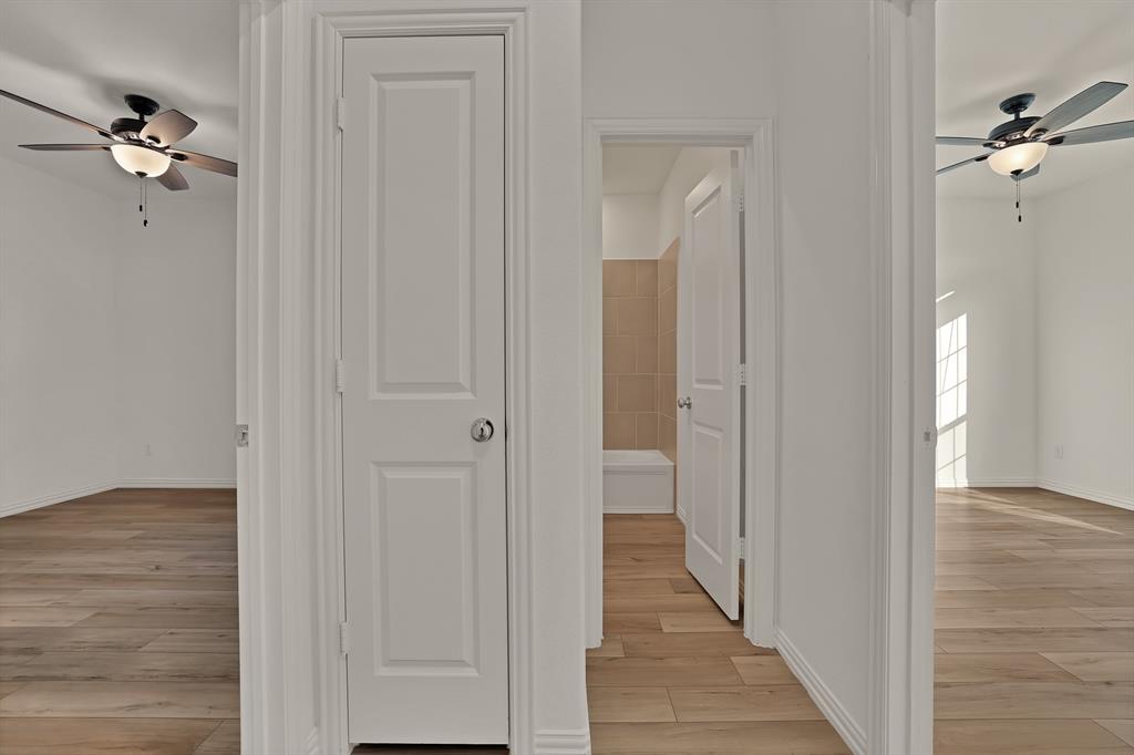 3204 Renaissance Drive Denton, TX 76207 - Photo 19 of 25 Interior hallway with light wood-finish flooring