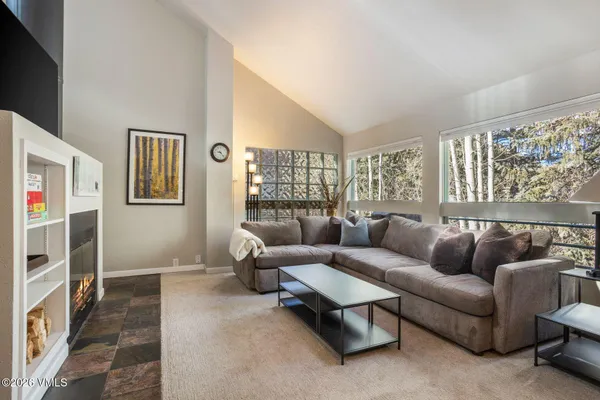 a living room with furniture and a window
