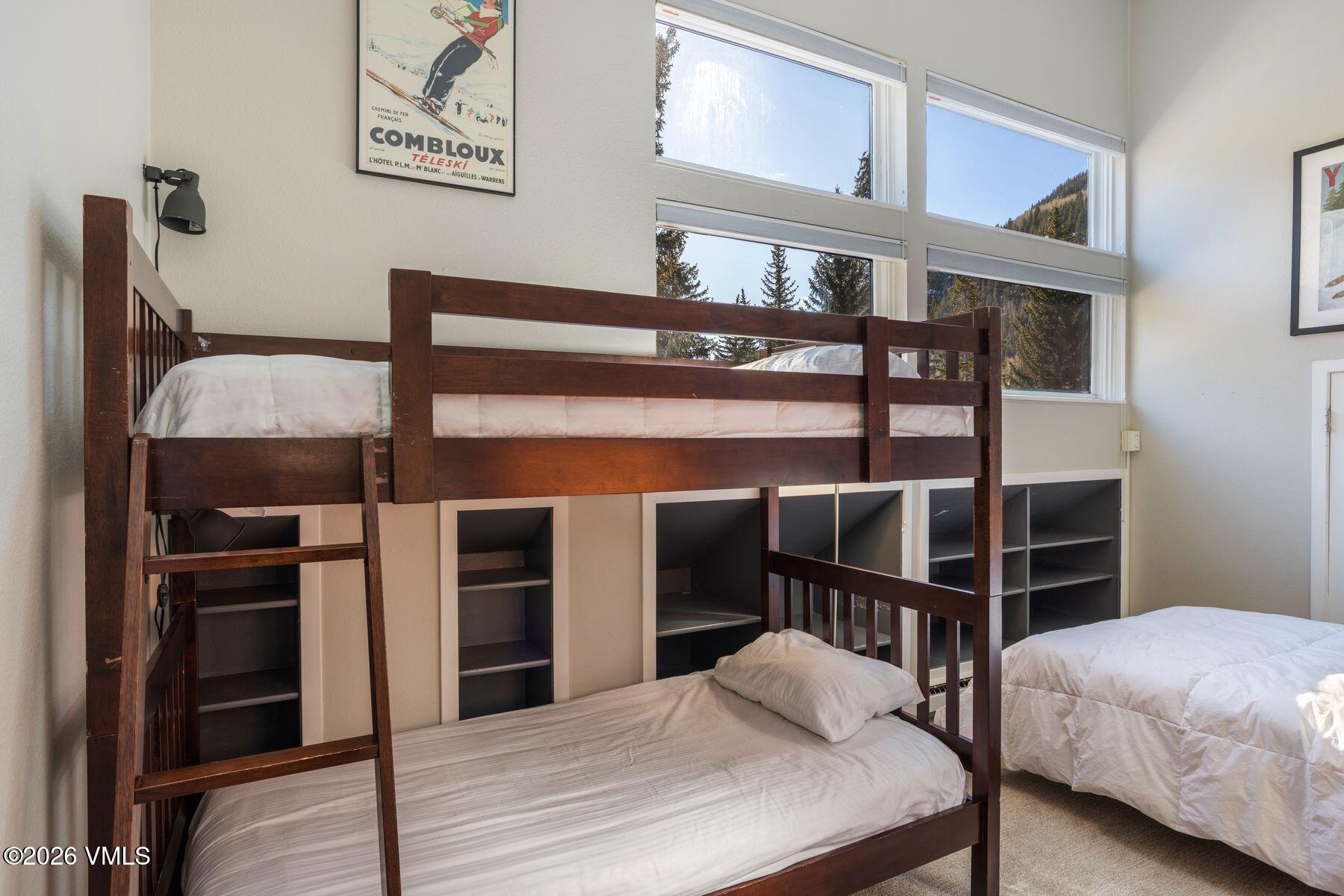 3911 Big Horn Road, Unit 1D Vail, CO 81657 - Photo 22 of 31 a bedroom with a bed and a window