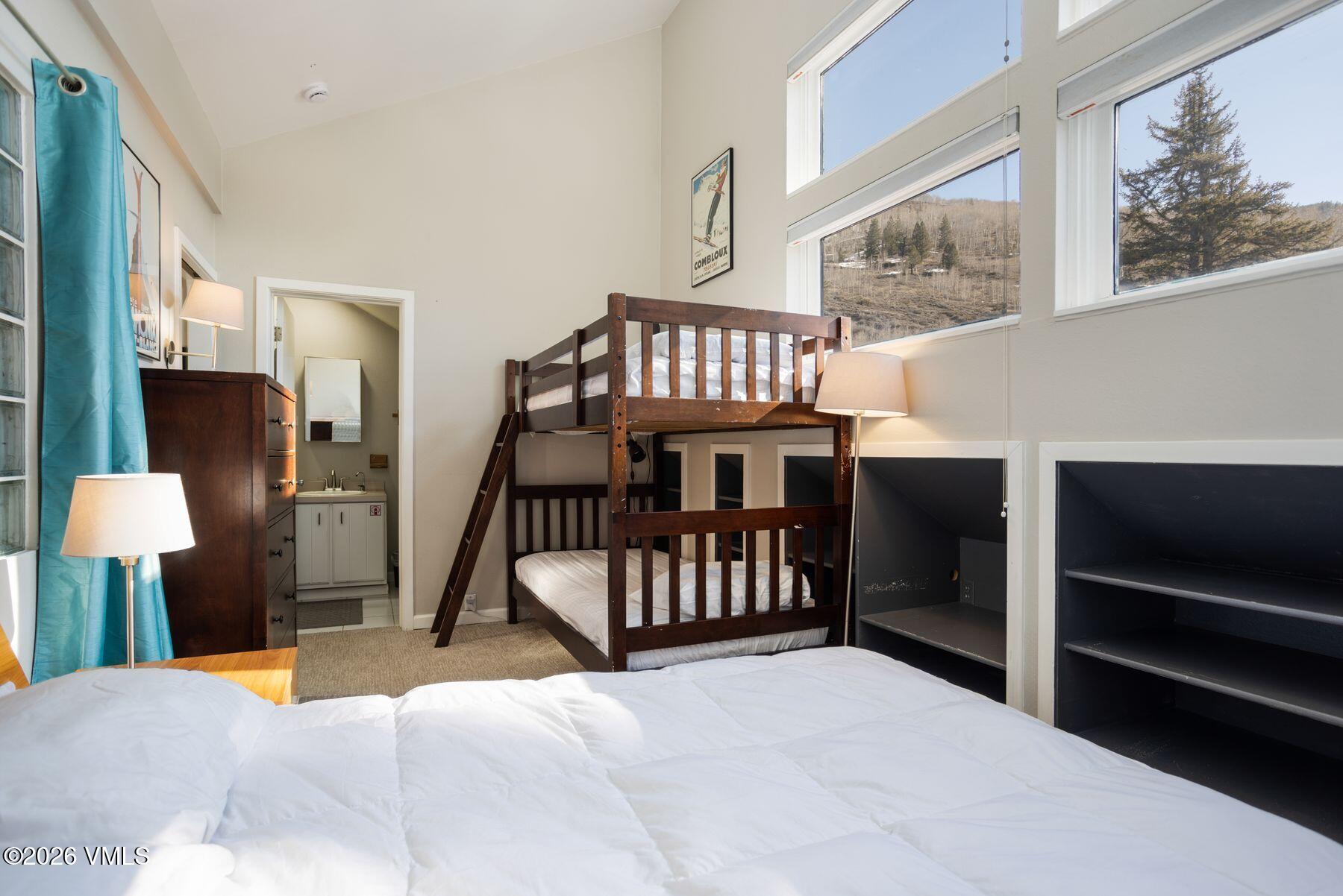 3911 Big Horn Road, Unit 1D Vail, CO 81657 - Photo 23 of 31 a bedroom with furniture and a window