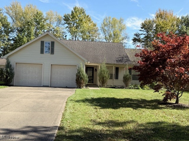 85 Oberlin Road Oberlin, OH 44074 - Photo 1 of 2 View of front of home featuring a front yard, driveway, and roof with shingles