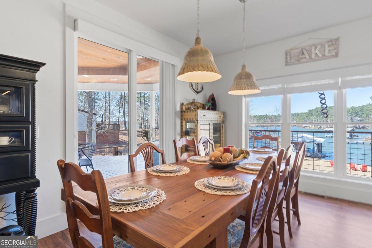 392 Big Oconee River Road Sparta, GA 31087 - Photo 20 of 69 a dining room with furniture a rug and a large window