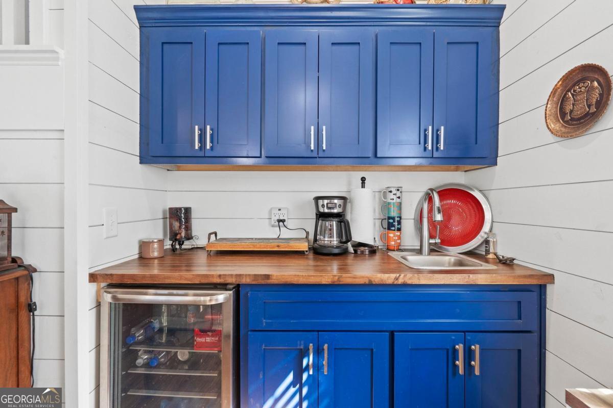 392 Big Oconee River Road Sparta, GA 31087 - Photo 26 of 69 a kitchen with a sink cabinets and stove
