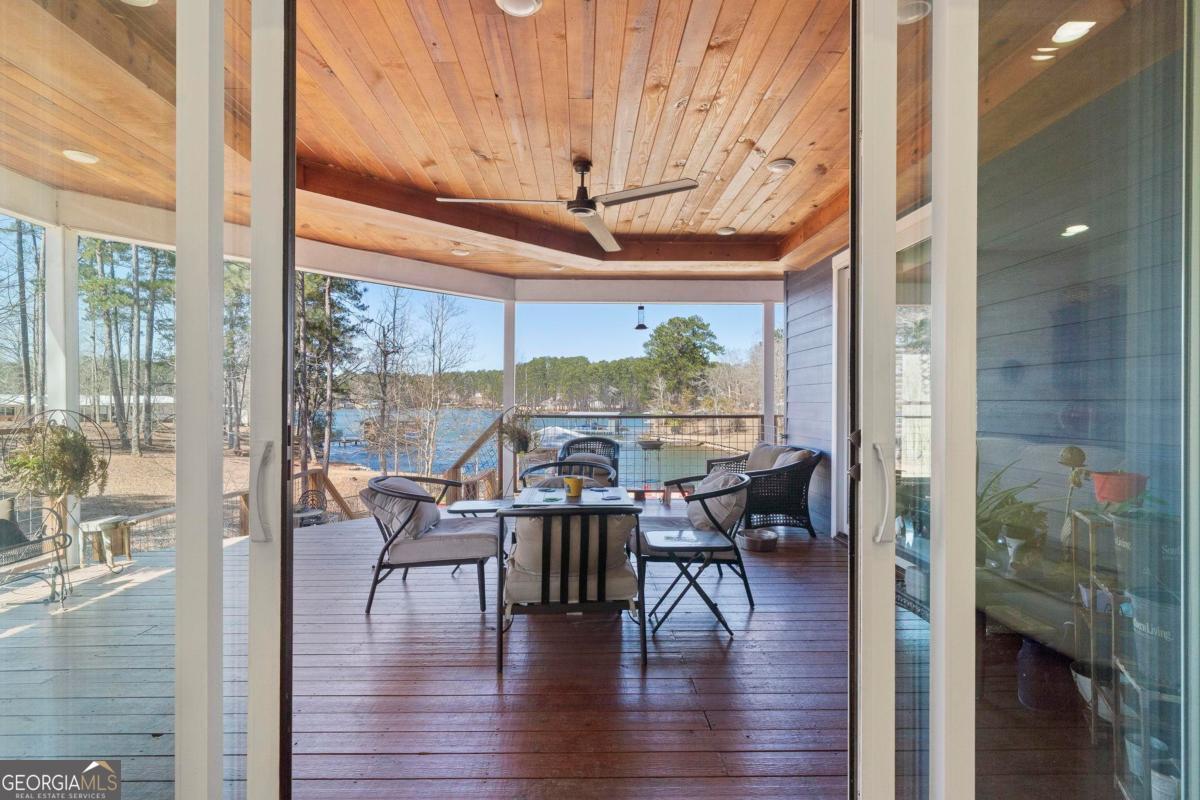 392 Big Oconee River Road Sparta, GA 31087 - Photo 27 of 69 a dining room with furniture window and wooden floor