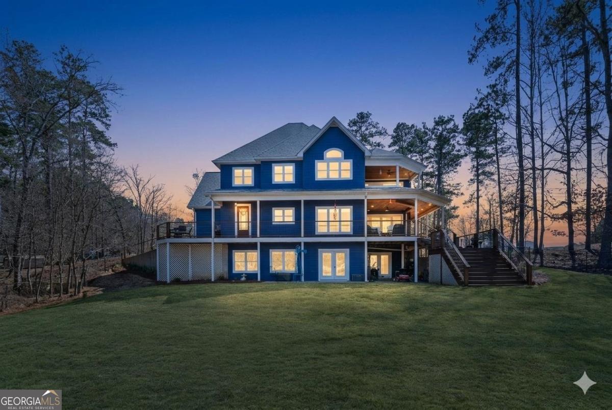 392 Big Oconee River Road Sparta, GA 31087 - Photo 3 of 69 a front view of a house with a yard