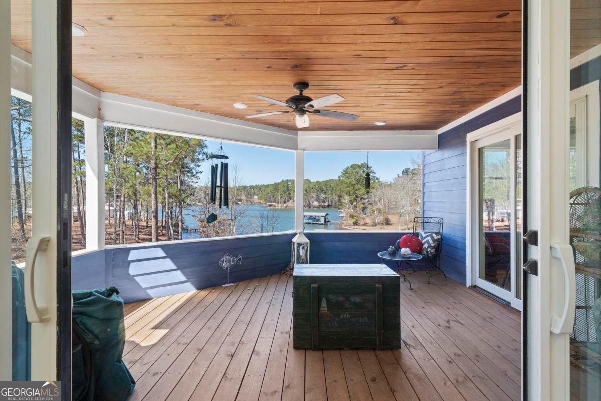392 Big Oconee River Road Sparta, GA 31087 - Photo 39 of 69 a living room with wooden floor and furniture