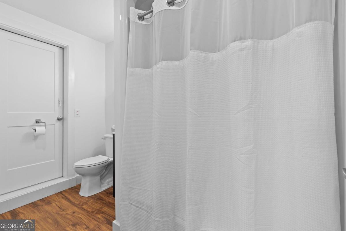 392 Big Oconee River Road Sparta, GA 31087 - Photo 49 of 69 a bathroom with a toilet and a shower