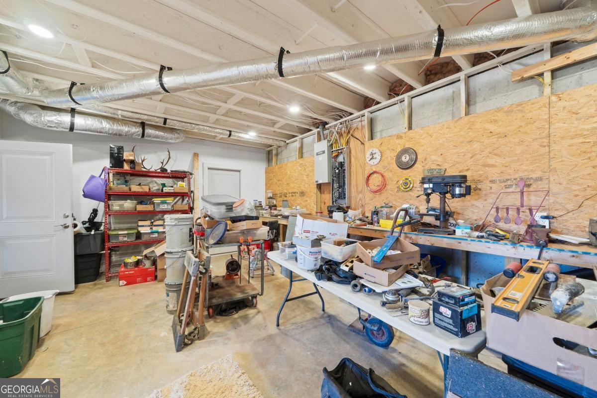 392 Big Oconee River Road Sparta, GA 31087 - Photo 53 of 69 a view of a storage room with racks on the wall