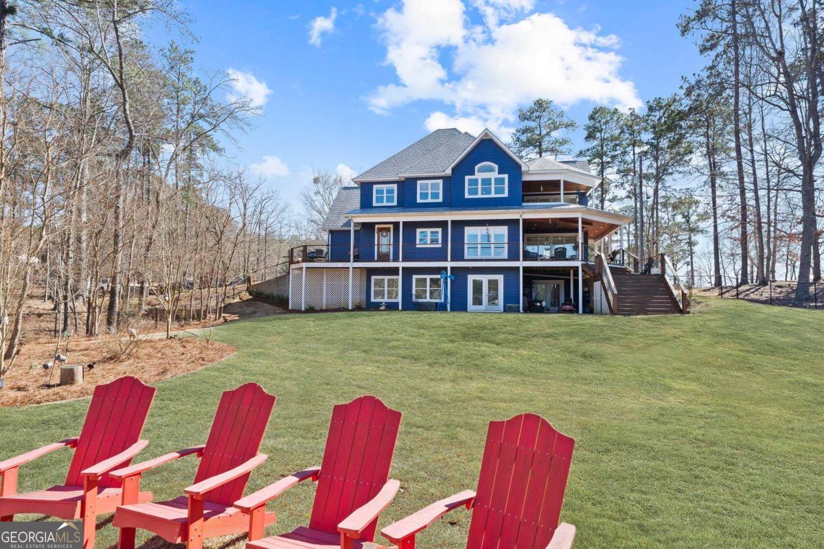 392 Big Oconee River Road Sparta, GA 31087 - Photo 56 of 69 a front view of a house with swimming pool having outdoor seating