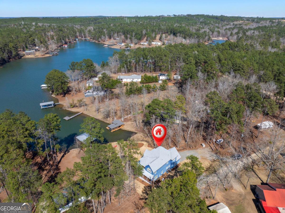 392 Big Oconee River Road Sparta, GA 31087 - Photo 6 of 69 an aerial view of a house with a garden