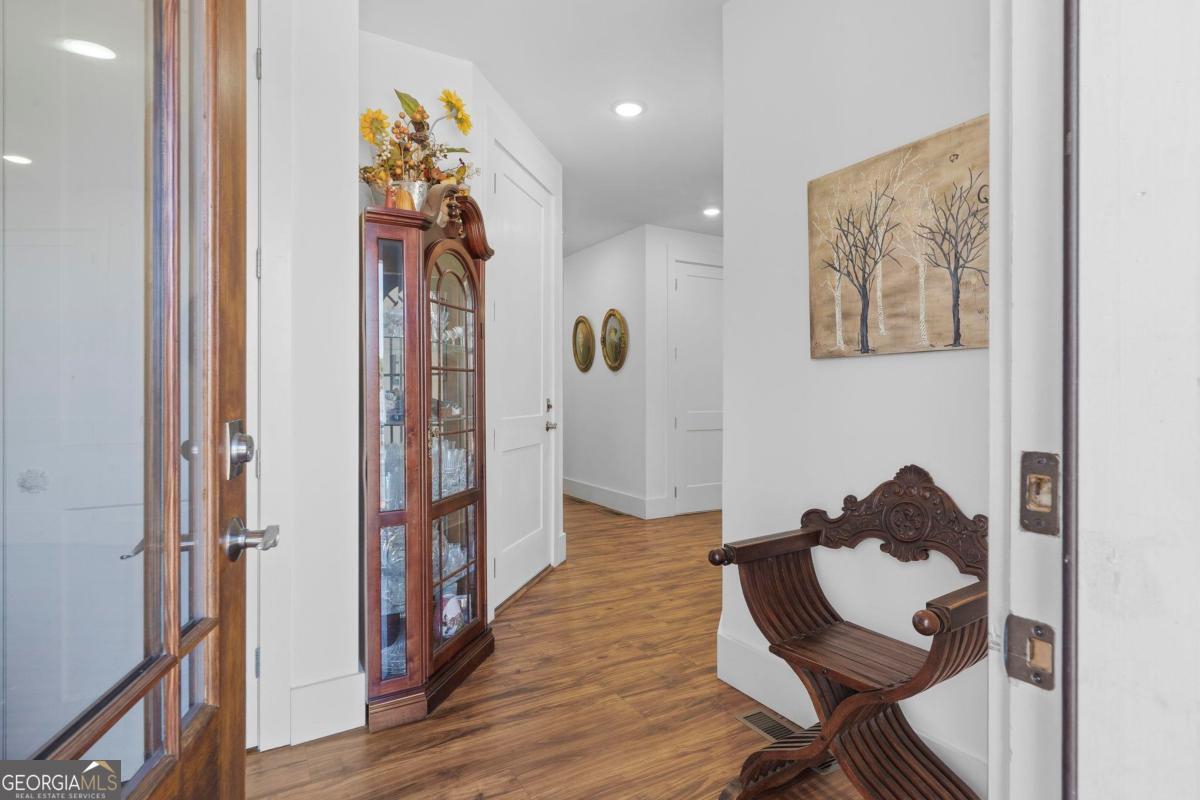 392 Big Oconee River Road Sparta, GA 31087 - Photo 9 of 69 a view of a hallway to a livingroom and furniture