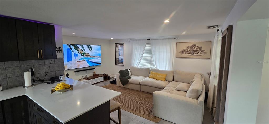 146 Marsella Road DeBary, FL 32713 - Photo 5 of 9 a living room with furniture and a flat screen tv