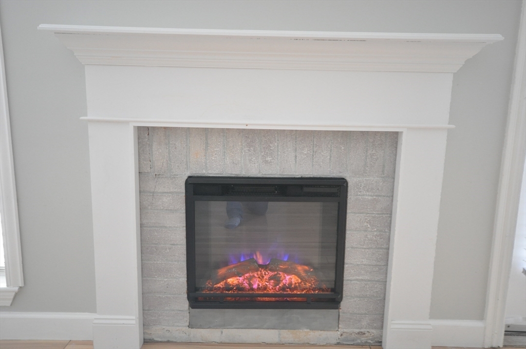 8 Walden Drive, Unit 13 Natick, MA 01760 - Photo 14 of 38 a hallway with a fireplace