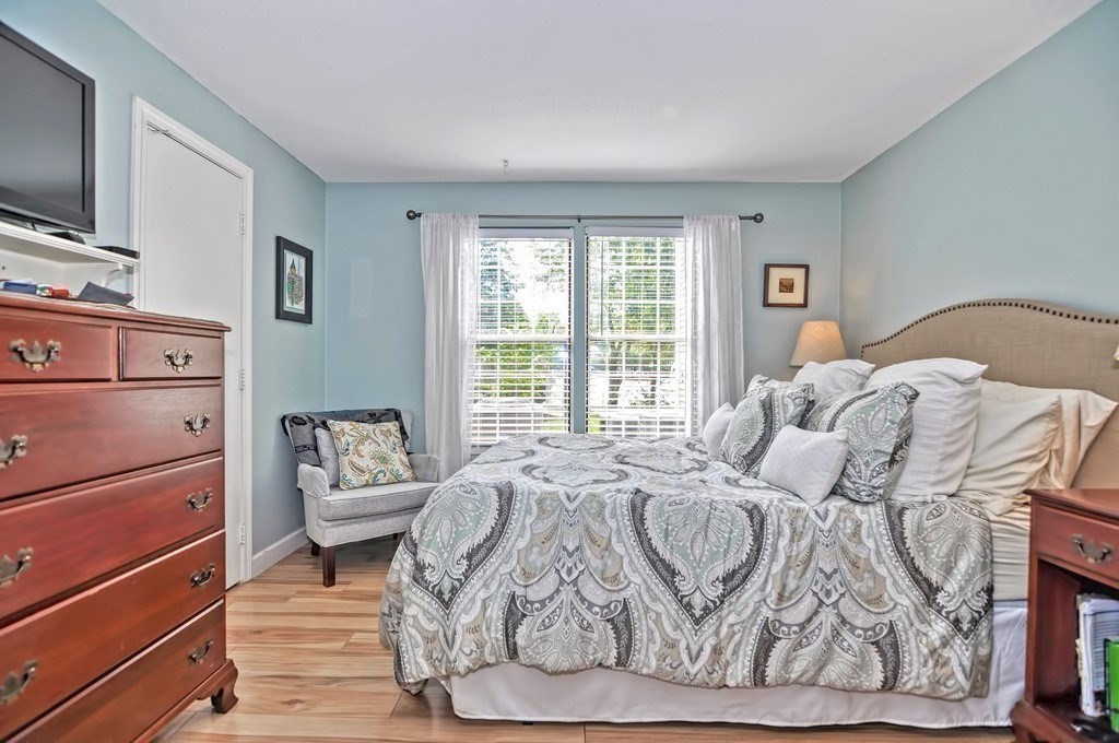 8 Walden Drive, Unit 13 Natick, MA 01760 - Photo 31 of 38 a bedroom with a bed and a window