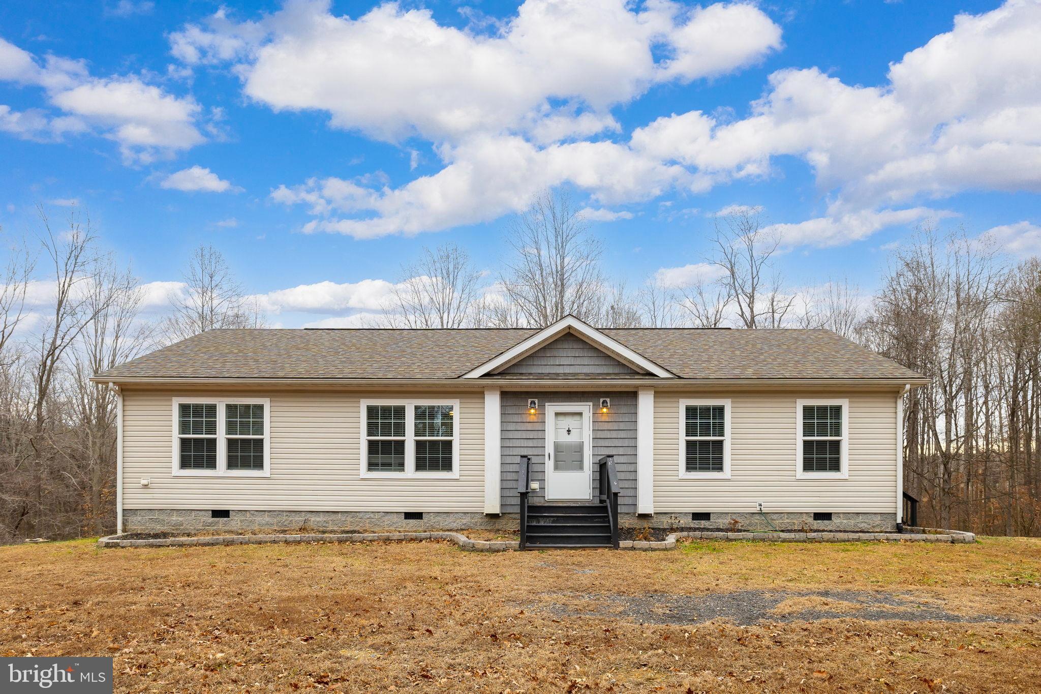 13115 Arcadia Road Woodford, VA 22580 - Photo 2 of 44 a front view of a house with a yard