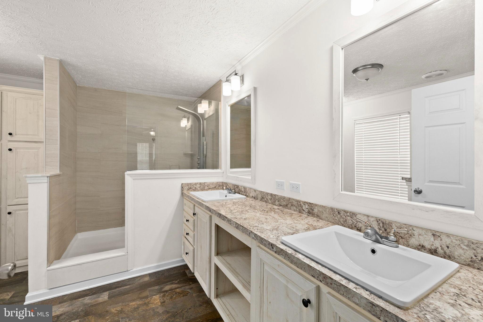 13115 Arcadia Road Woodford, VA 22580 - Photo 22 of 44 a bathroom with a granite countertop sink mirror and double