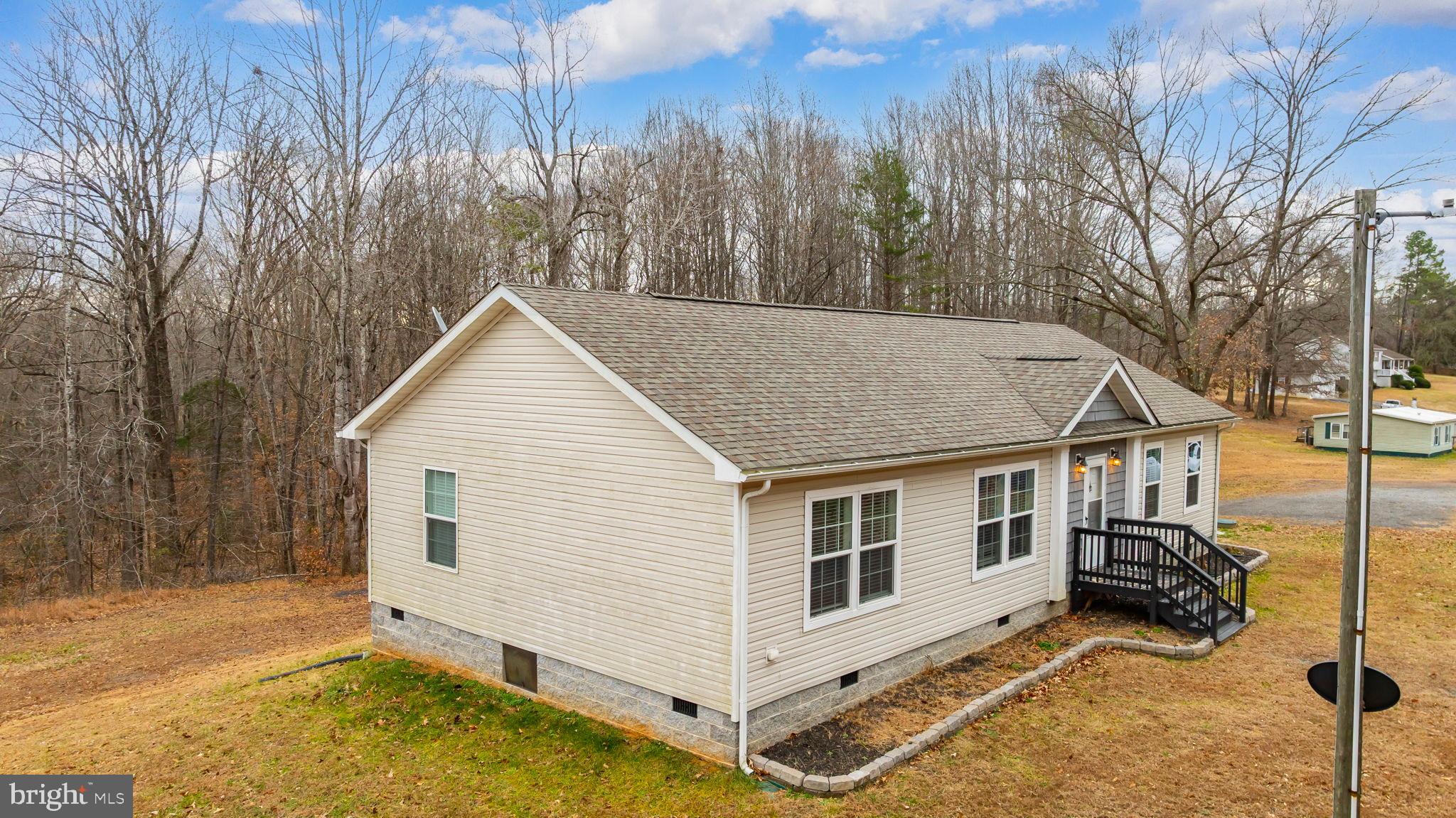 13115 Arcadia Road Woodford, VA 22580 - Photo 3 of 44 a view of a house with a yard covered in snow