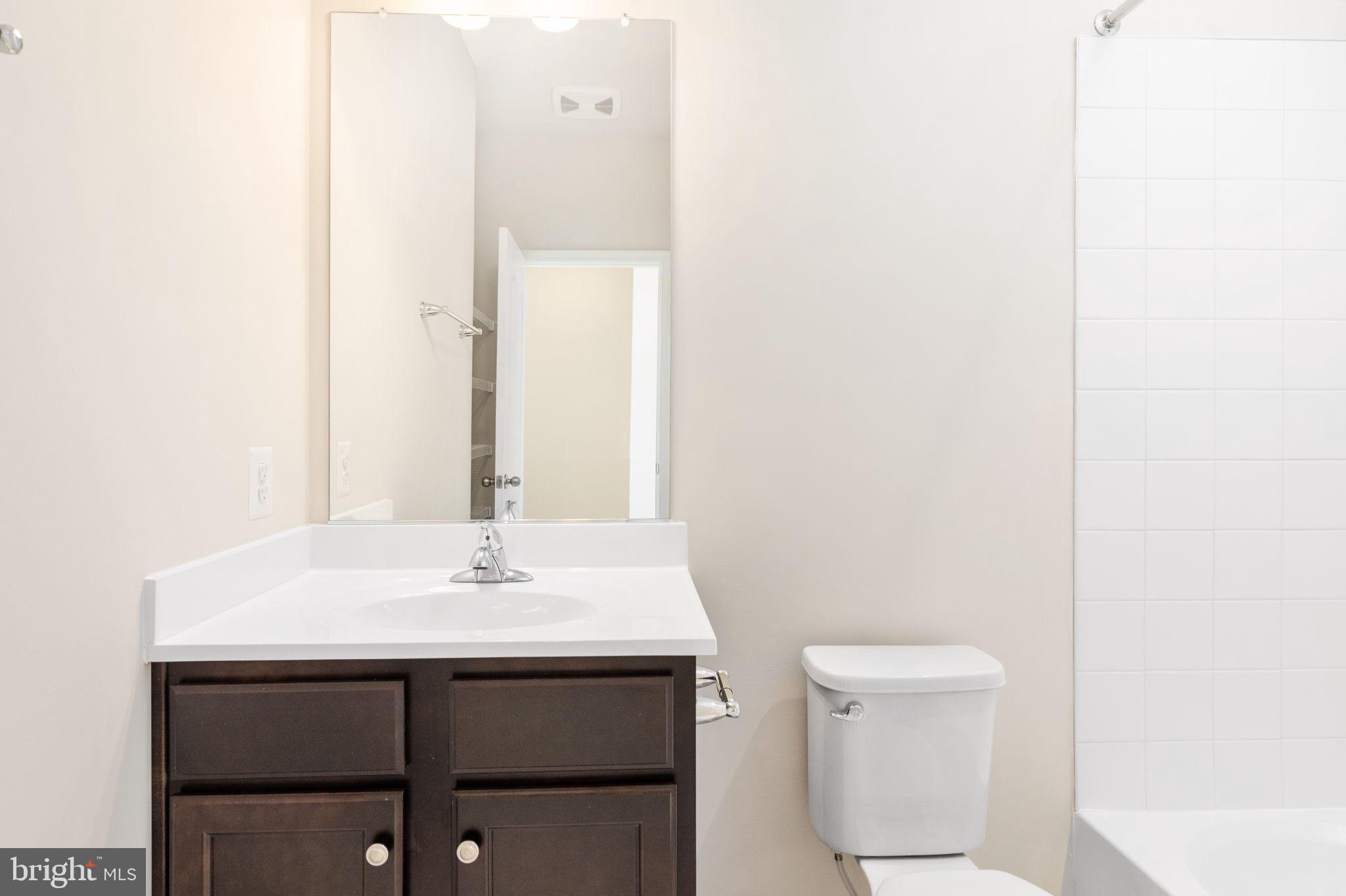 1815 Bird Run Frederick, MD 21702 - Photo 18 of 23 a bathroom with a sink a toilet and mirror