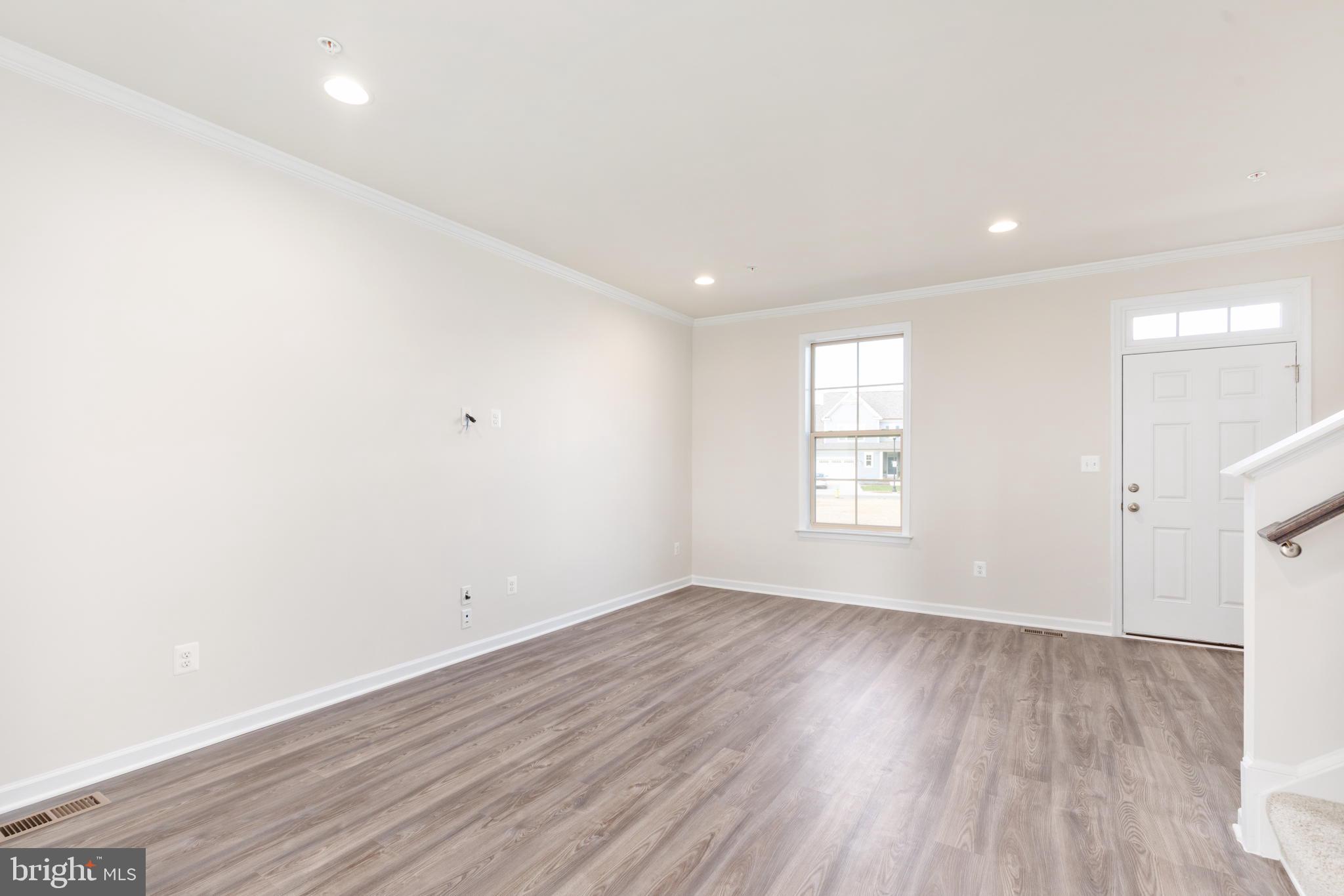 1815 Bird Run Frederick, MD 21702 - Photo 3 of 23 an empty room with wooden floor and windows