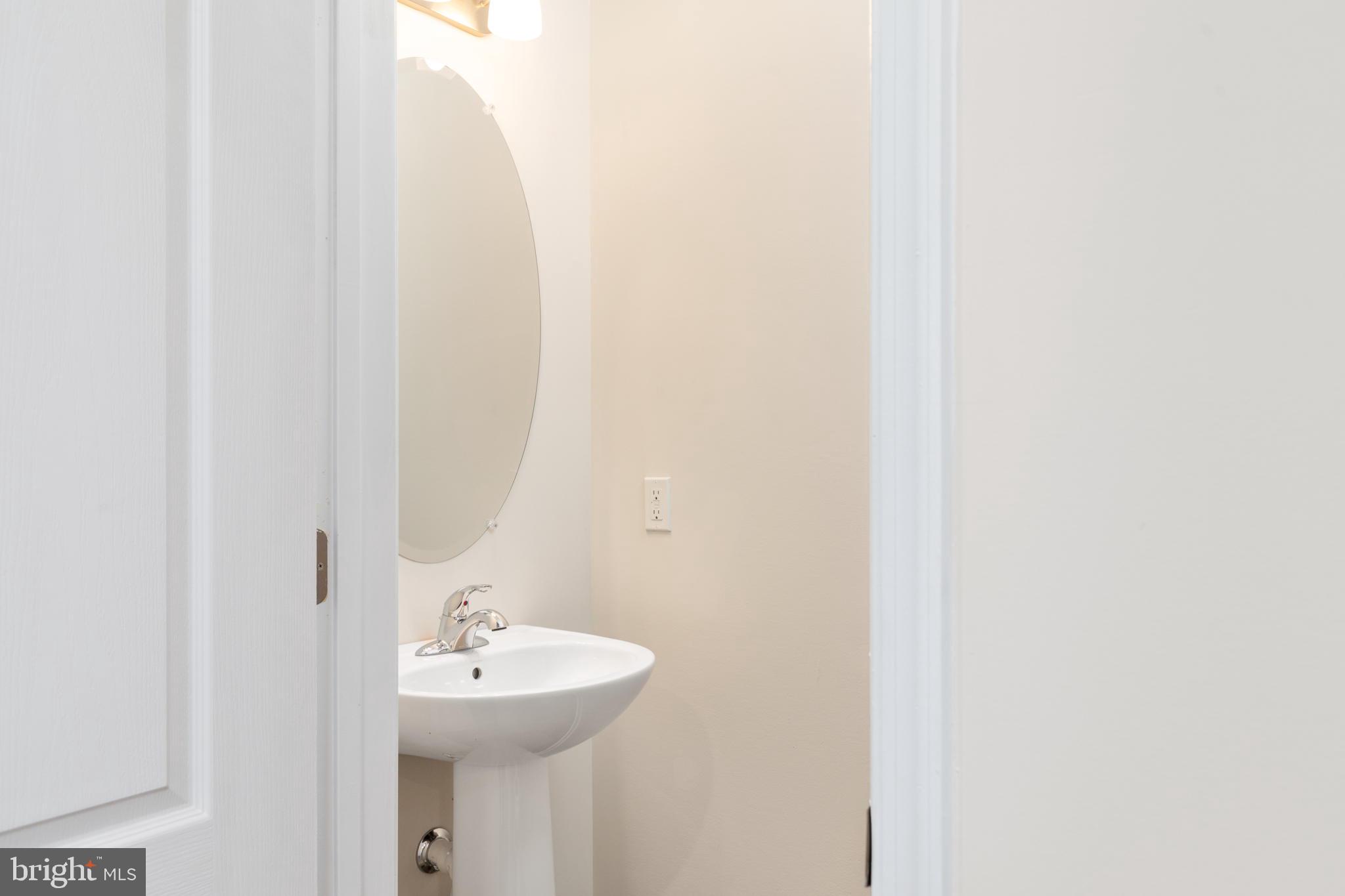 1815 Bird Run Frederick, MD 21702 - Photo 4 of 23 a bathroom with a sink and a mirror