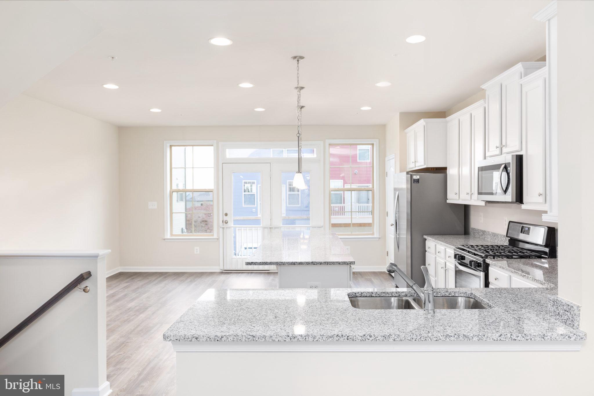1815 Bird Run Frederick, MD 21702 - Photo 6 of 23 a kitchen with stainless steel appliances granite countertop a sink and a counter top space