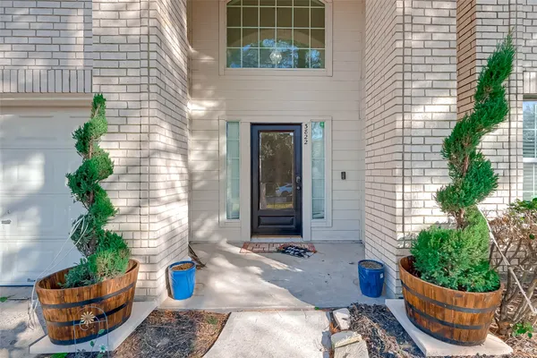 a backyard of a house with potted plants