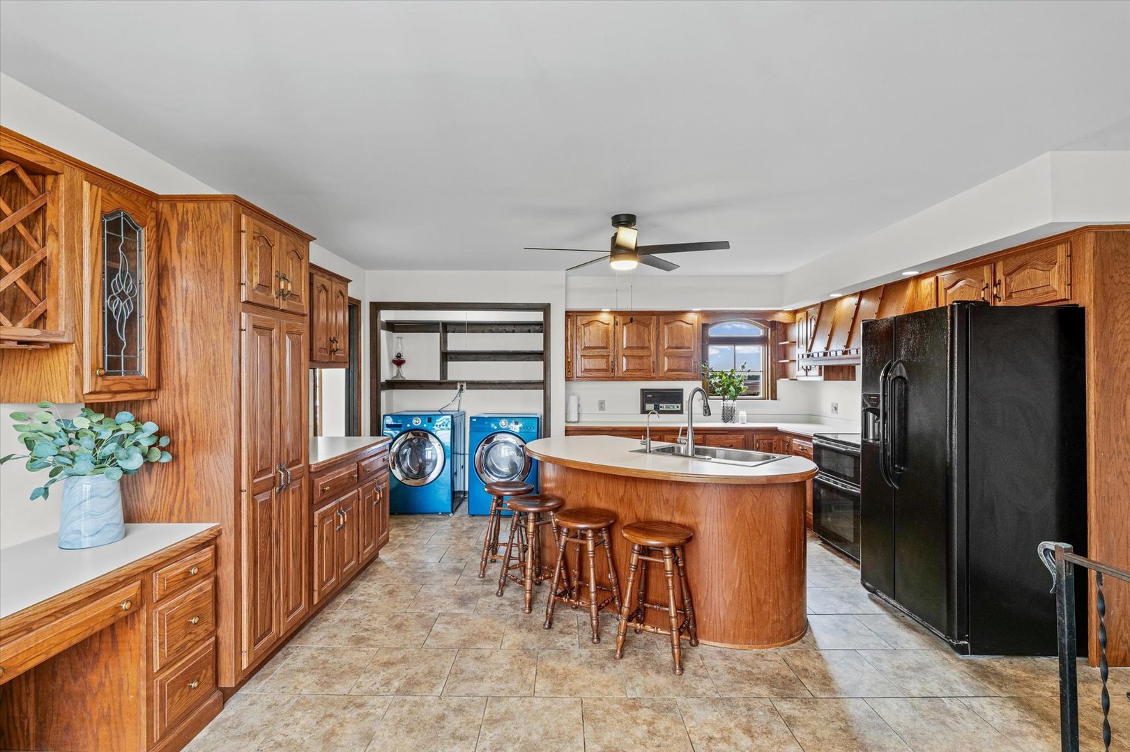 7961 North 3000 E Road Forrest, IL 61741 - Photo 21 of 66 a kitchen with stainless steel appliances granite countertop a refrigerator a sink a stove and a dining table