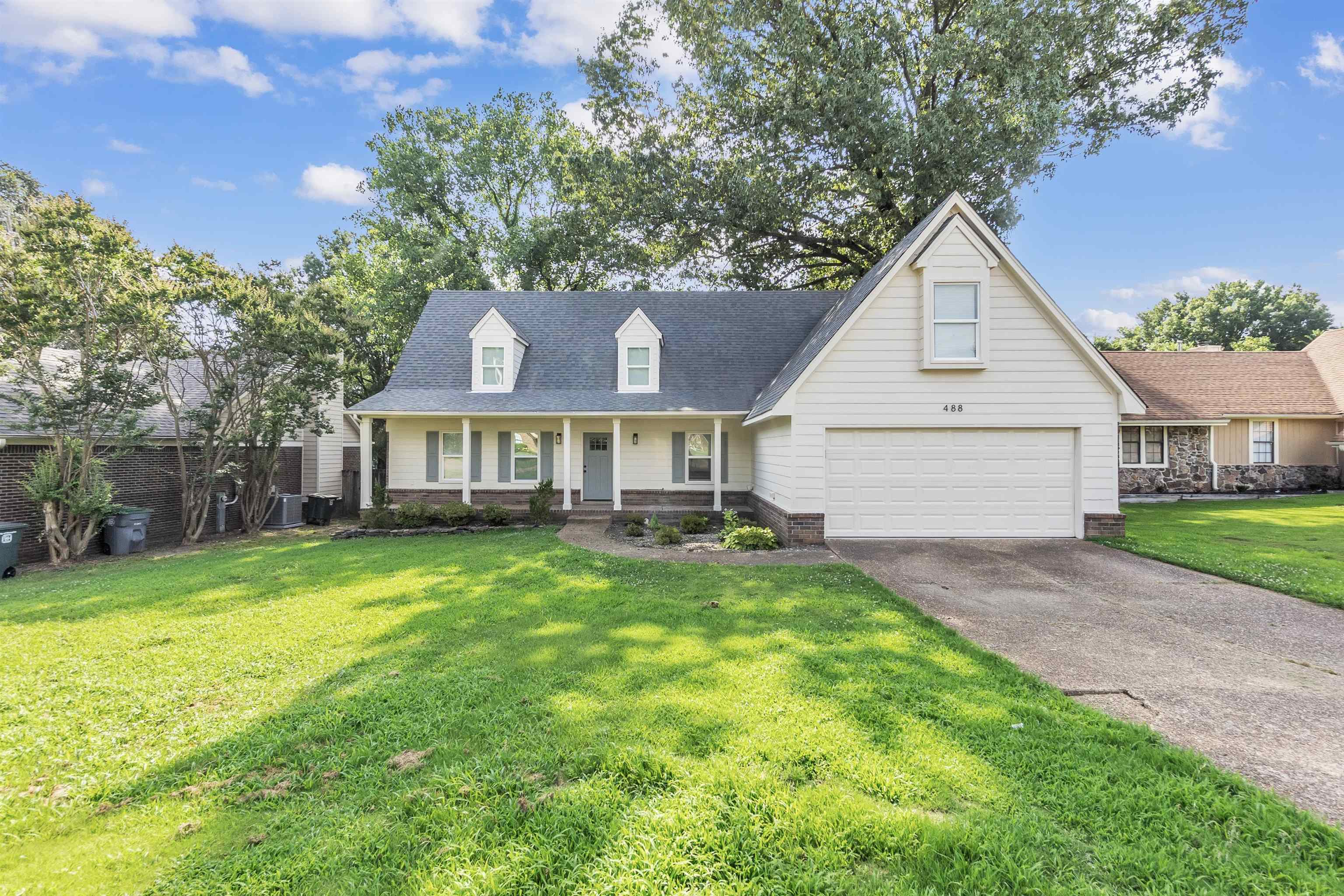 488 West Regis Place Memphis, TN 38018 - Photo 1 of 17 Cape cod house featuring a porch and asphalt driveway