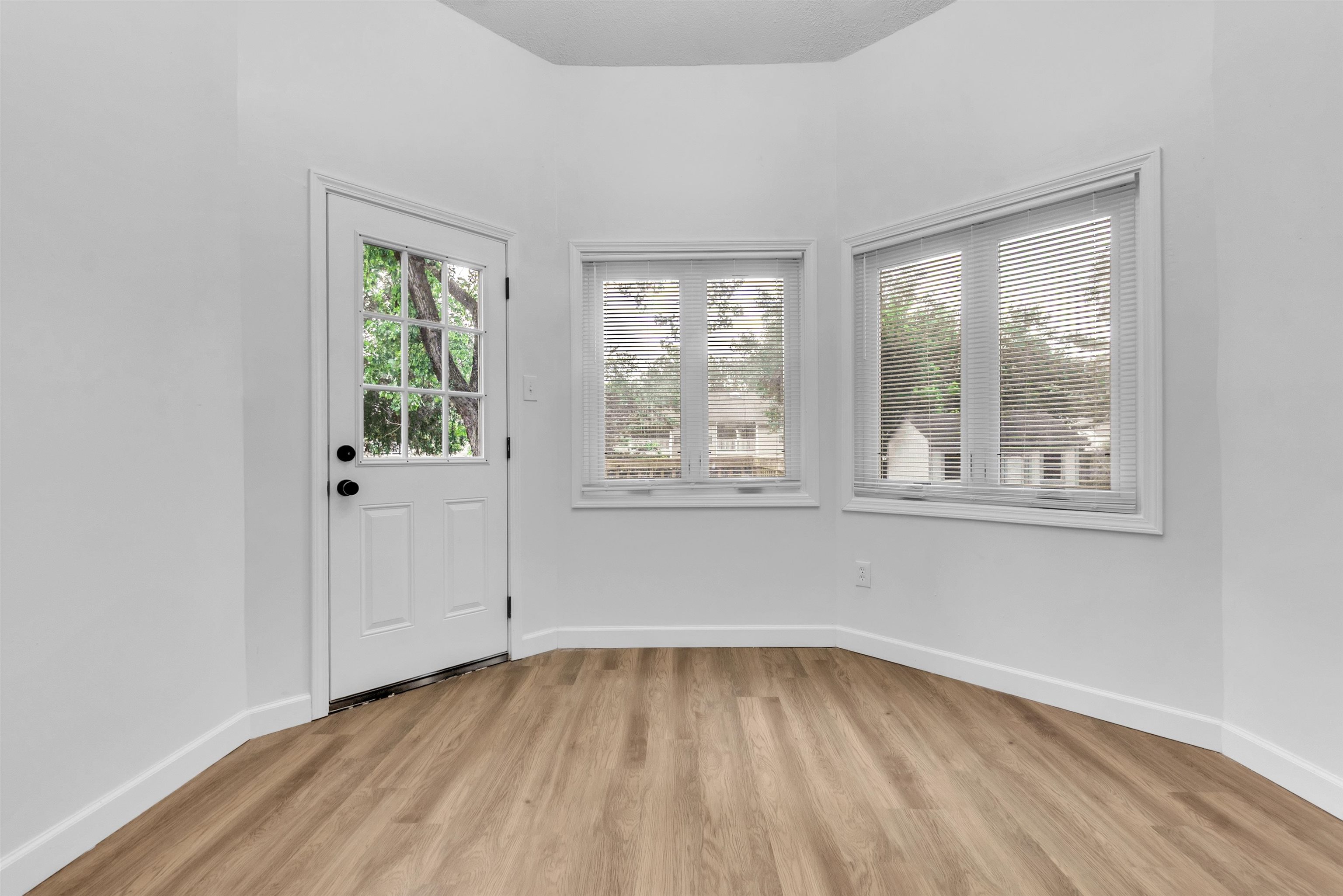 488 West Regis Place Memphis, TN 38018 - Photo 8 of 17 Doorway to outside featuring wood finished floors and baseboards